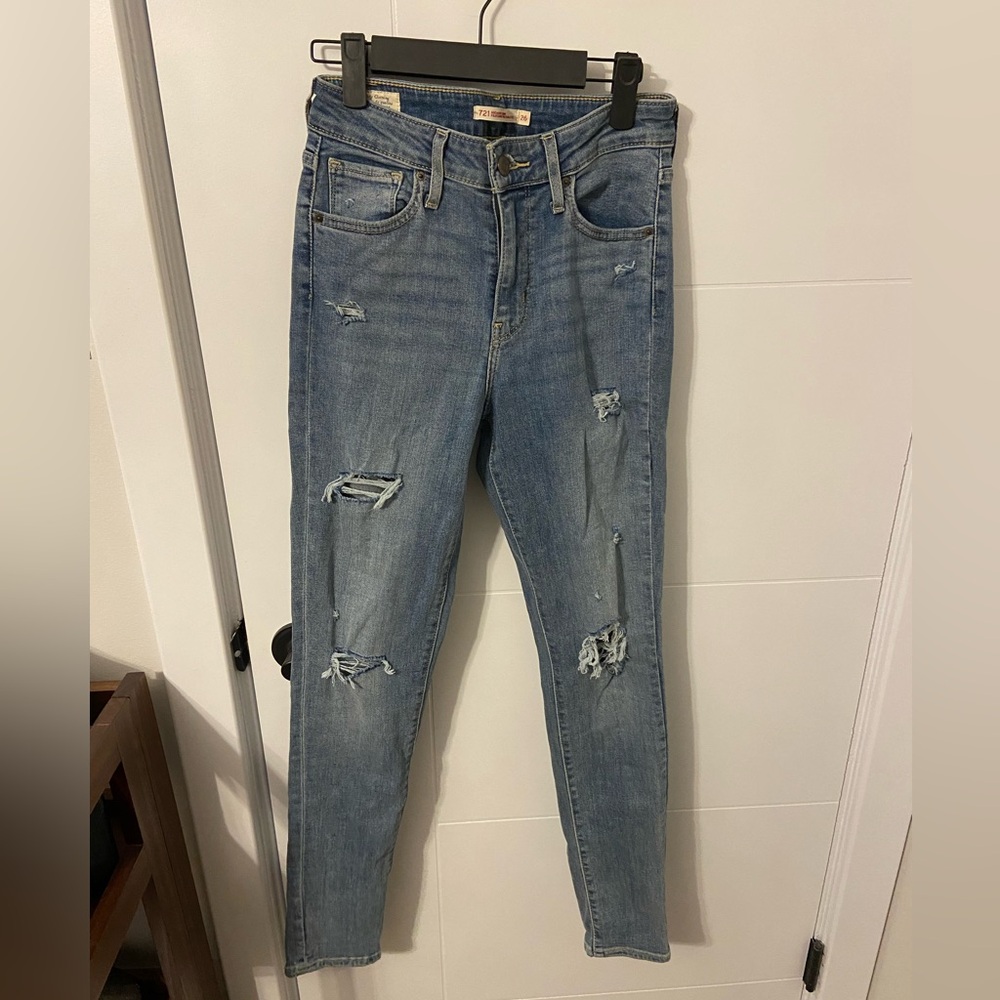 Size 26. Levi distressed high rise jeans.